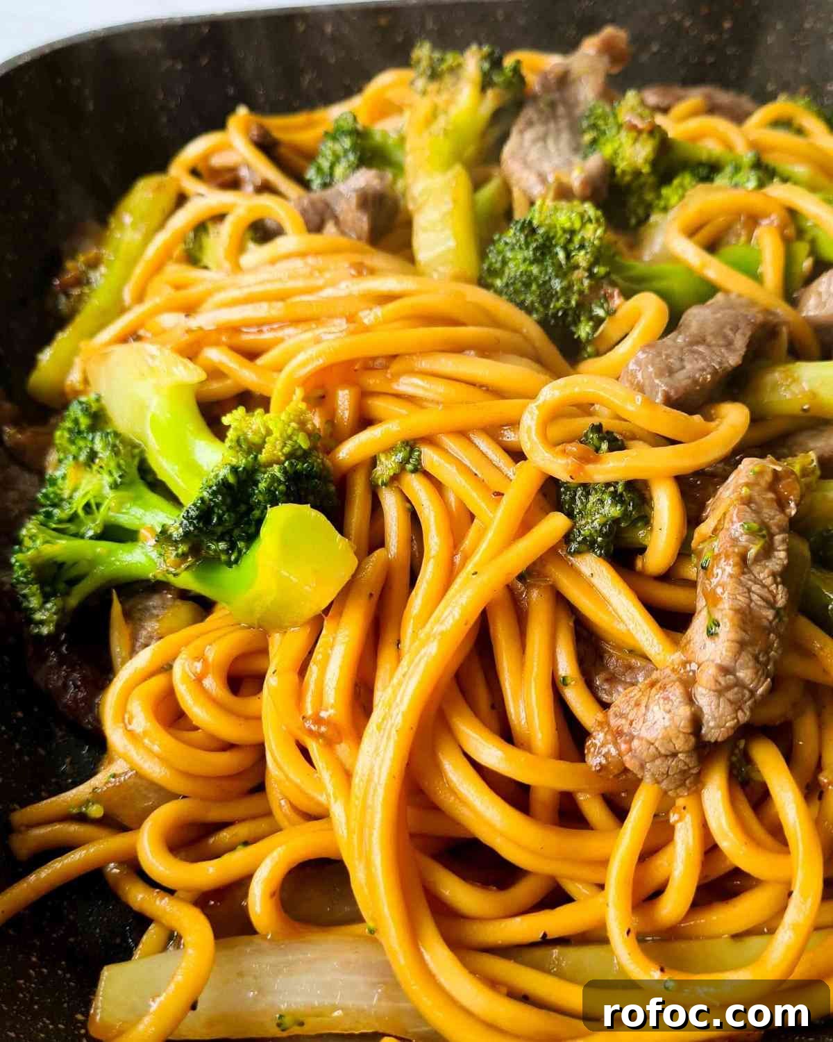 Beef and Broccoli Stir-Fry Noodles Recipe 11 Close up of noodle stir fry steaming from the frying pan
