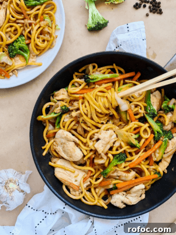 Stir fried noodle sin a black pan