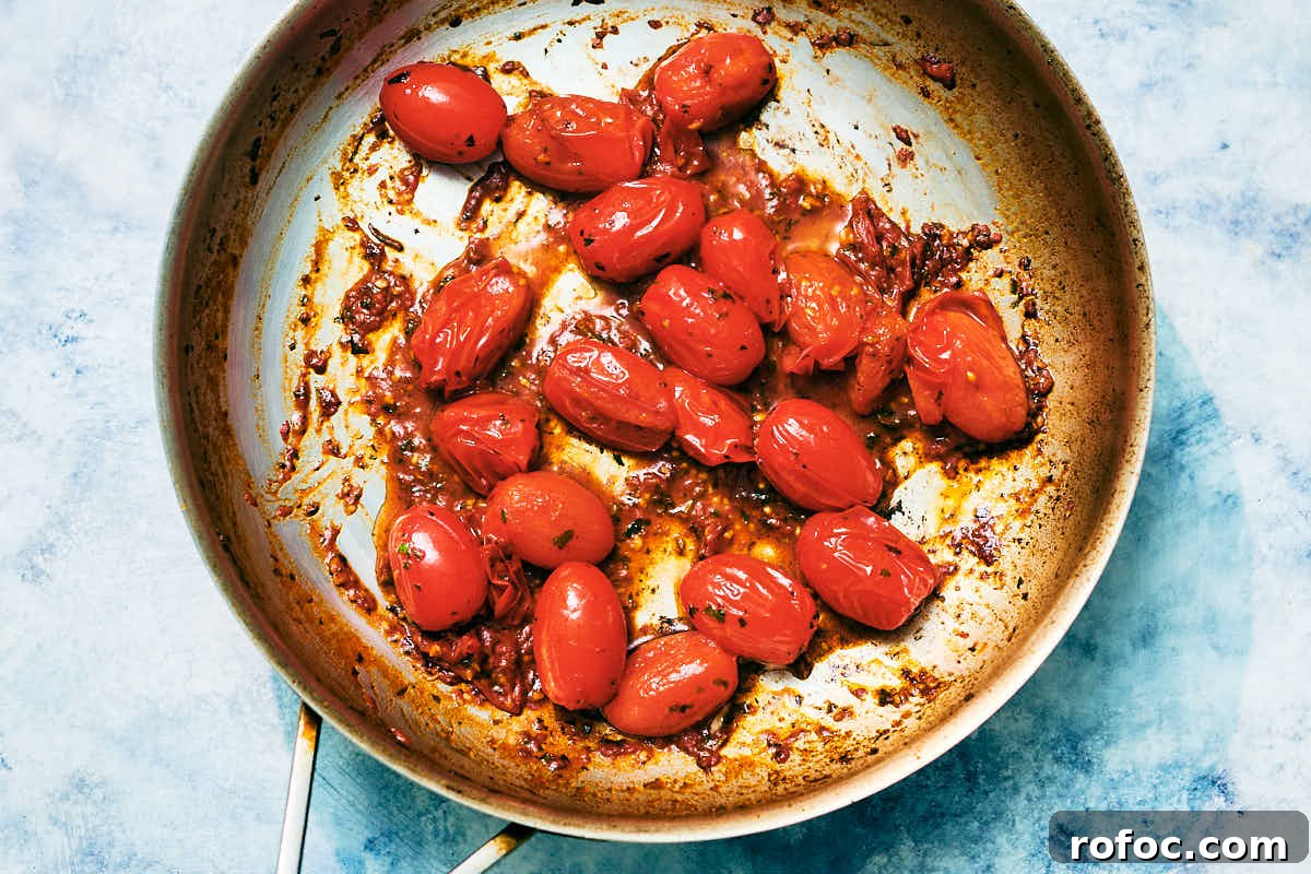 Red Chimichurri Pasta Recipe — Serve Hot or Chilled 11 Sauteed cherry tomatoes in a skillet.