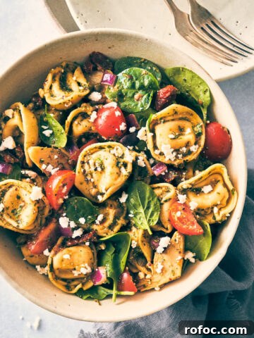 Bowl of tortellini topped with feta and veggies
