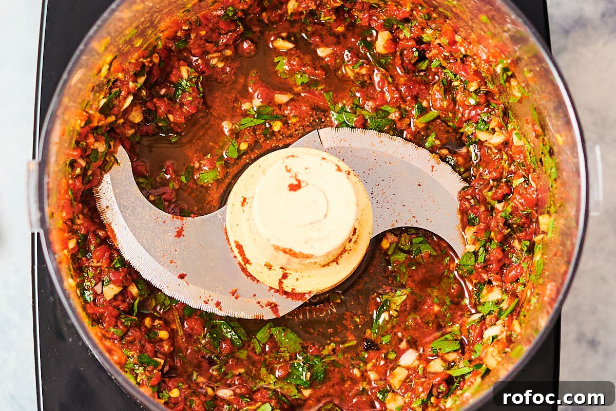Red Chimichurri Pasta Recipe — Serve Hot or Chilled 7 Making Red Chimichurri Pasta in a food processor.