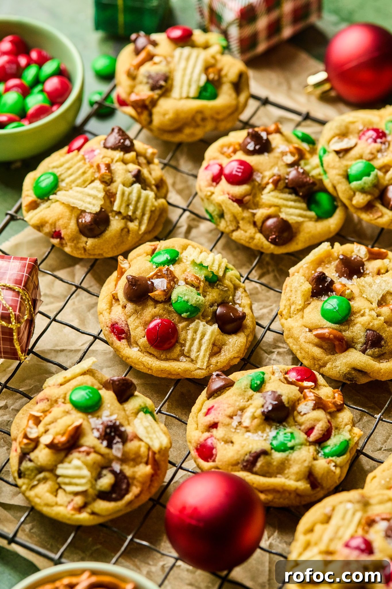 Santa’s Trash Cookies: Festive No-Bake Candy Cookie Recipe 8 santas trash cookies on a black cooling rack.