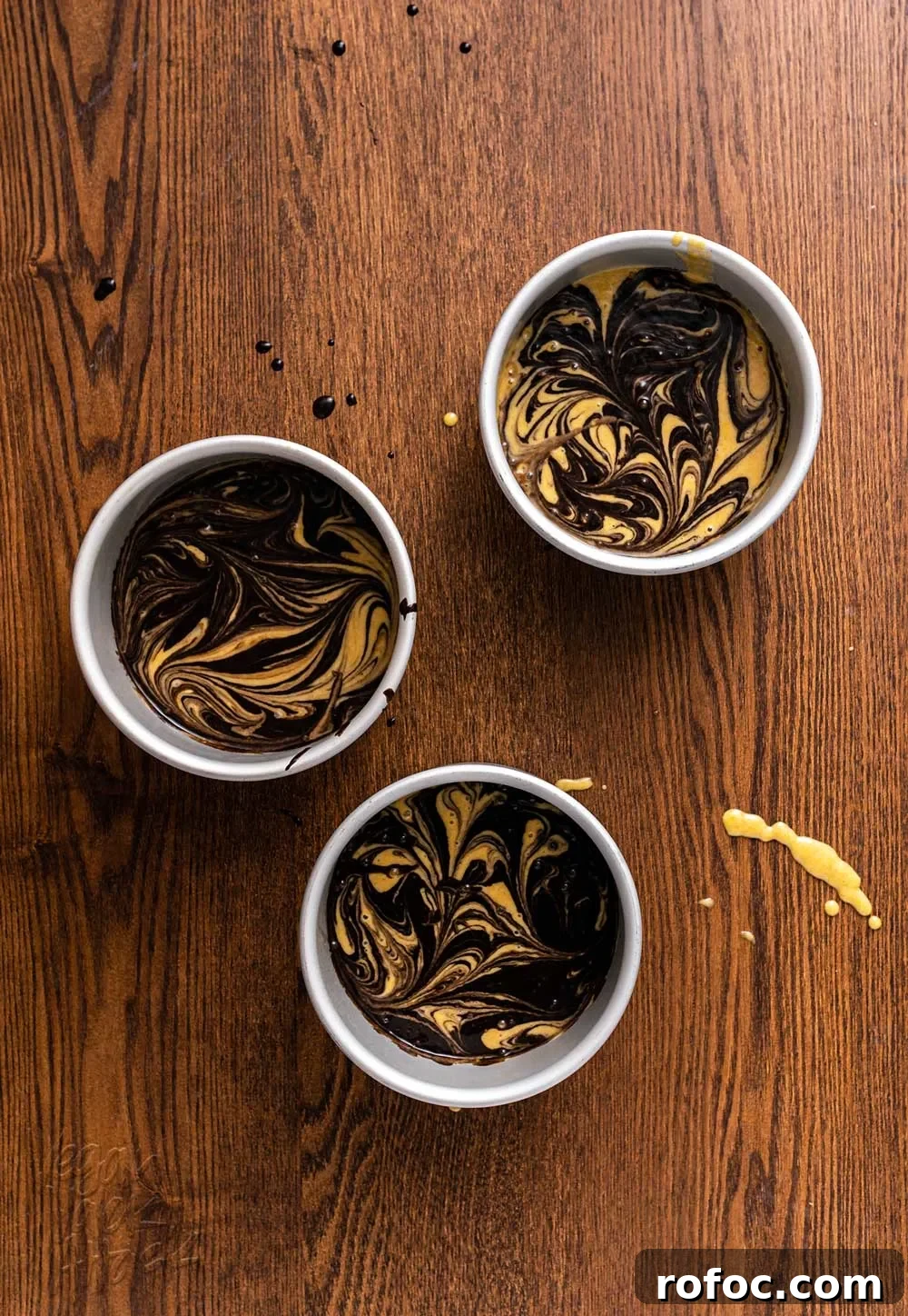 Vegan Pumpkin Chocolate Marble Cake with Silky Ganache 4 Three cake pans filled with marbled cake batter before baking