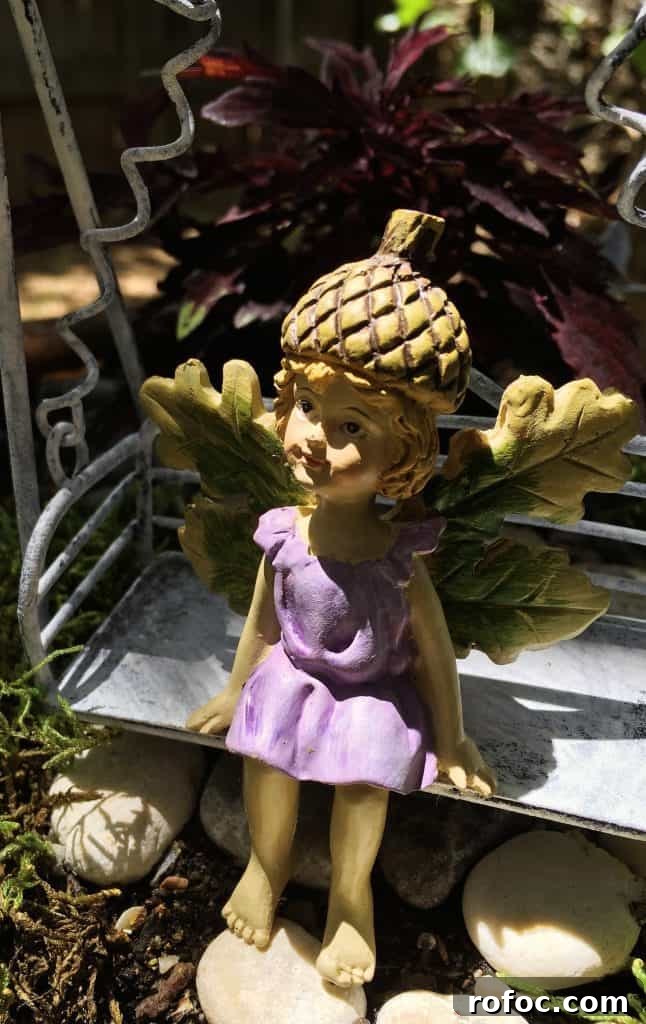 How to Build a Charming DIY Fairy Garden in Your Yard 8 Fairy Garden Fairy Close up