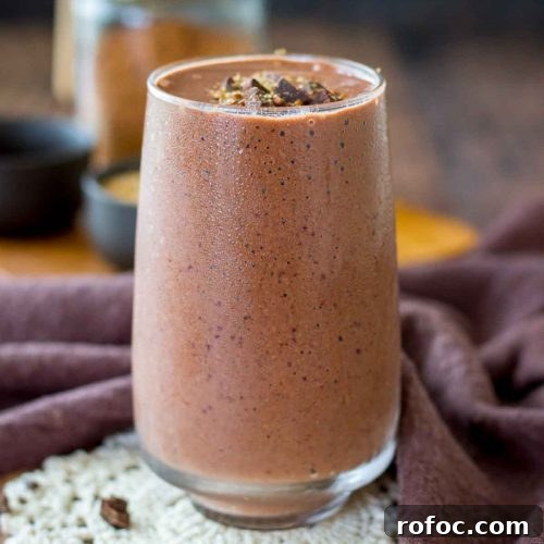 Cherry Chocolate Smoothie served in a glass topped with dark chocolate