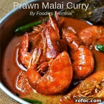 Kadai Prawns Recipe: Spicy Indian-Style Prawns in Kadai Sauce 15 Prawn Malai Curry served in an aluminum plate in a red curry sauce