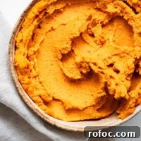 Spicy Harissa Hummus Recipe: Creamy Homemade Dip in Minutes 12 Harissa hummus in a small bowl viewed from above.