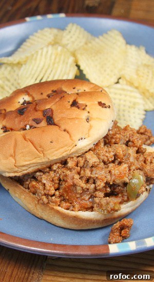 A hearty meal served on a hamburger bun.