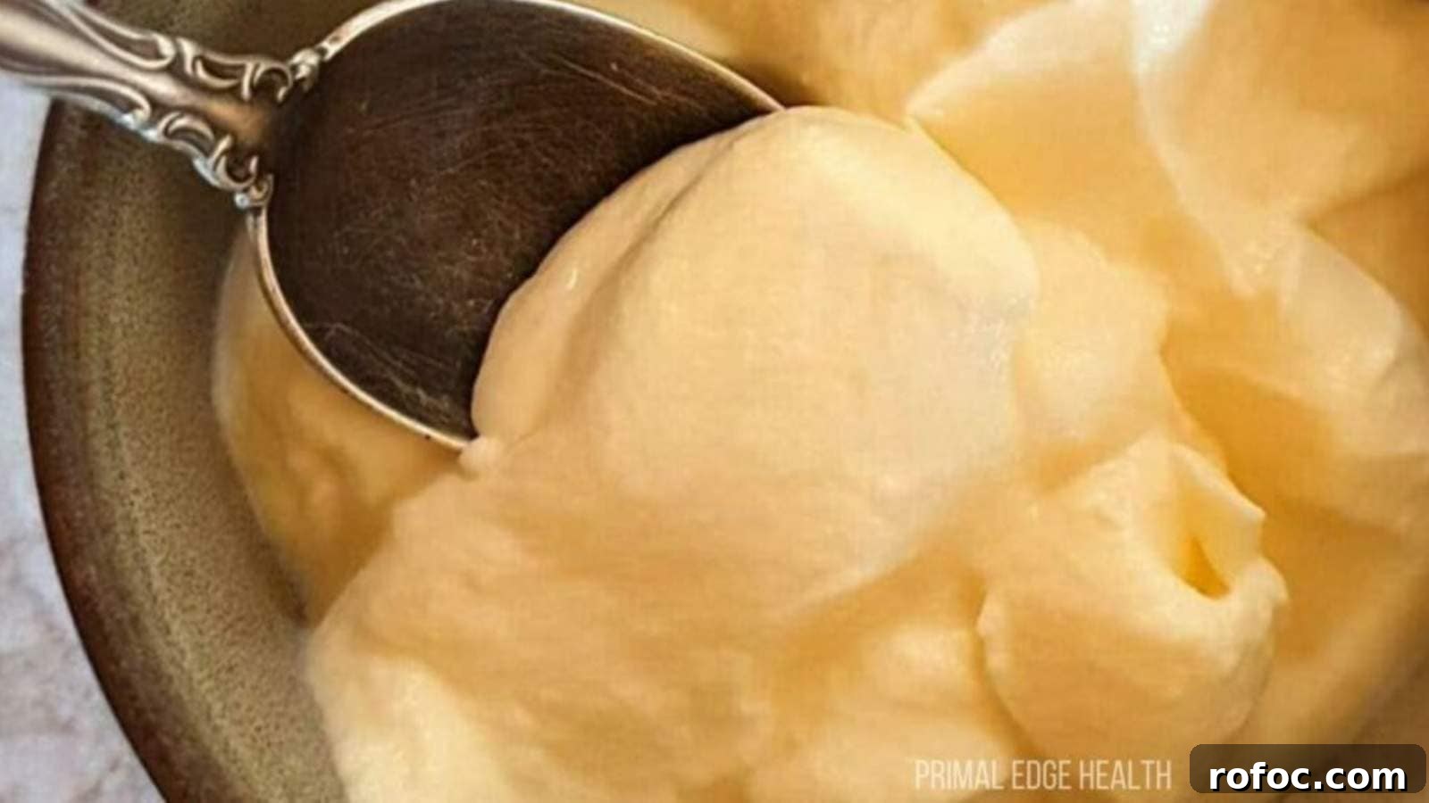 15 Low-Carb Recipes That Taste Like You Spent Hours 6 A spoon dipping into a bowl of cheesecake fluff.