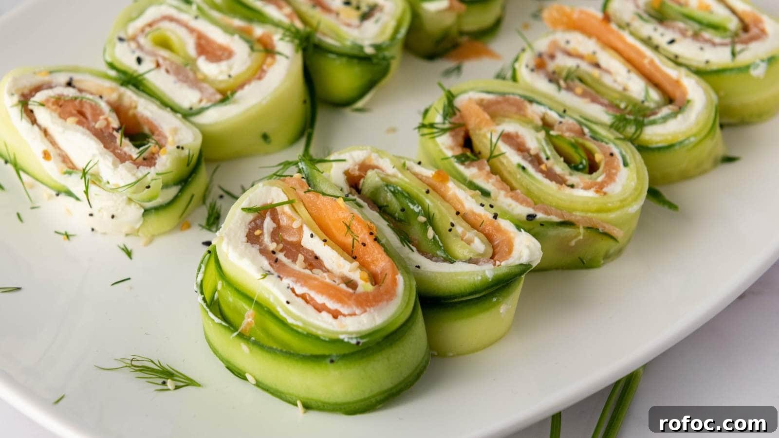 15 Low-Carb Recipes That Taste Like You Spent Hours 8 Cucumber roll ups on a plate filled with cream cheese, smoked salmon, and garnished with dill.
