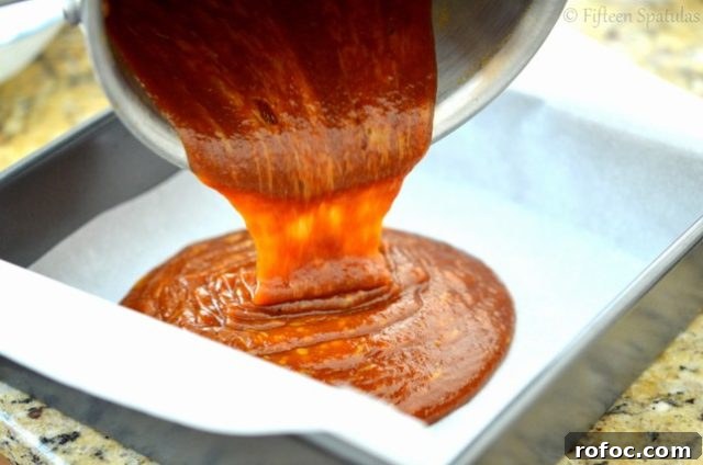 Soft Pumpkin Caramels Recipe | fifteenspatulas.com Pouring the Caramel Mixture into Pan to Set