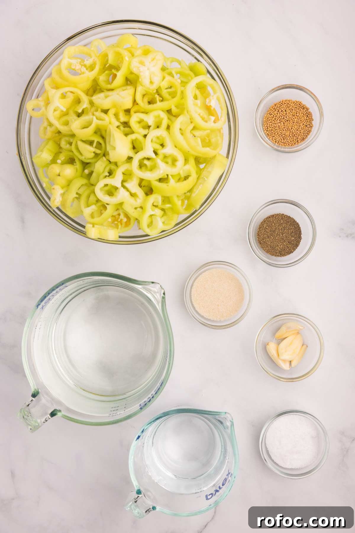 How to Can Homemade Pickled Banana Peppers for Long-Term Storage 3 ingredients measured out on counter.
