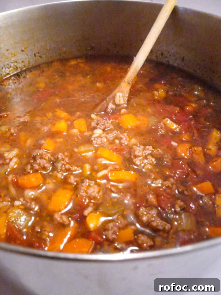 Classic Amish Beef and Barley Soup Recipe for Cozy Meals 4 cooking a large pot of Amish beef barley soup.