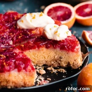 Blood Orange Upside-Down Cake Recipe & Citrus Glaze Tips 17 A straight on photo of the sliced cake.