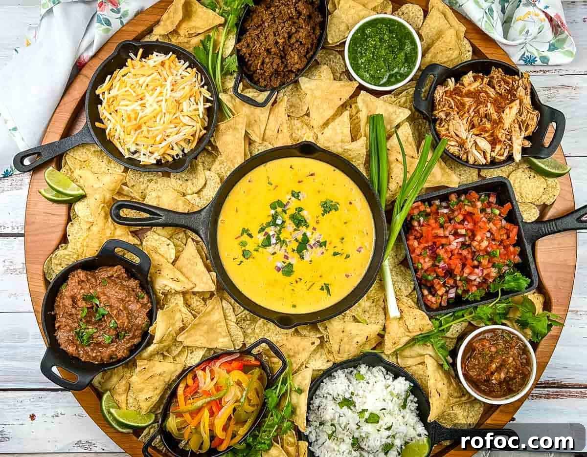 19 Fall Cookout Recipes for Sunday Dinner and Game Day 17 A platter of nachos with different toppings.