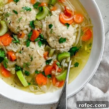 Hearty Vegetable and Barley Soup Recipe for Cozy Meals 12 completed Vegan Matzo Ball Soup in a bowl