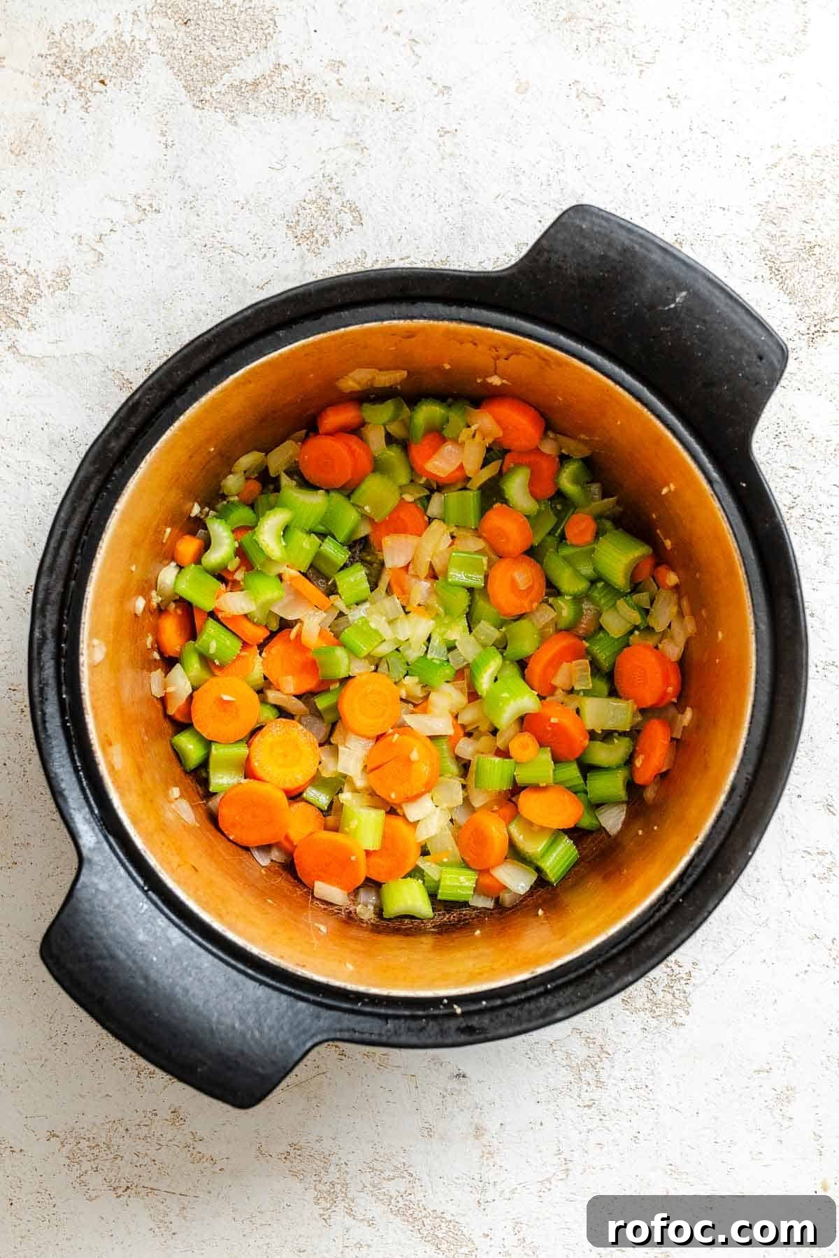 Hearty Vegetable and Barley Soup Recipe for Cozy Meals 4 Process shot showing veggies added to pot.