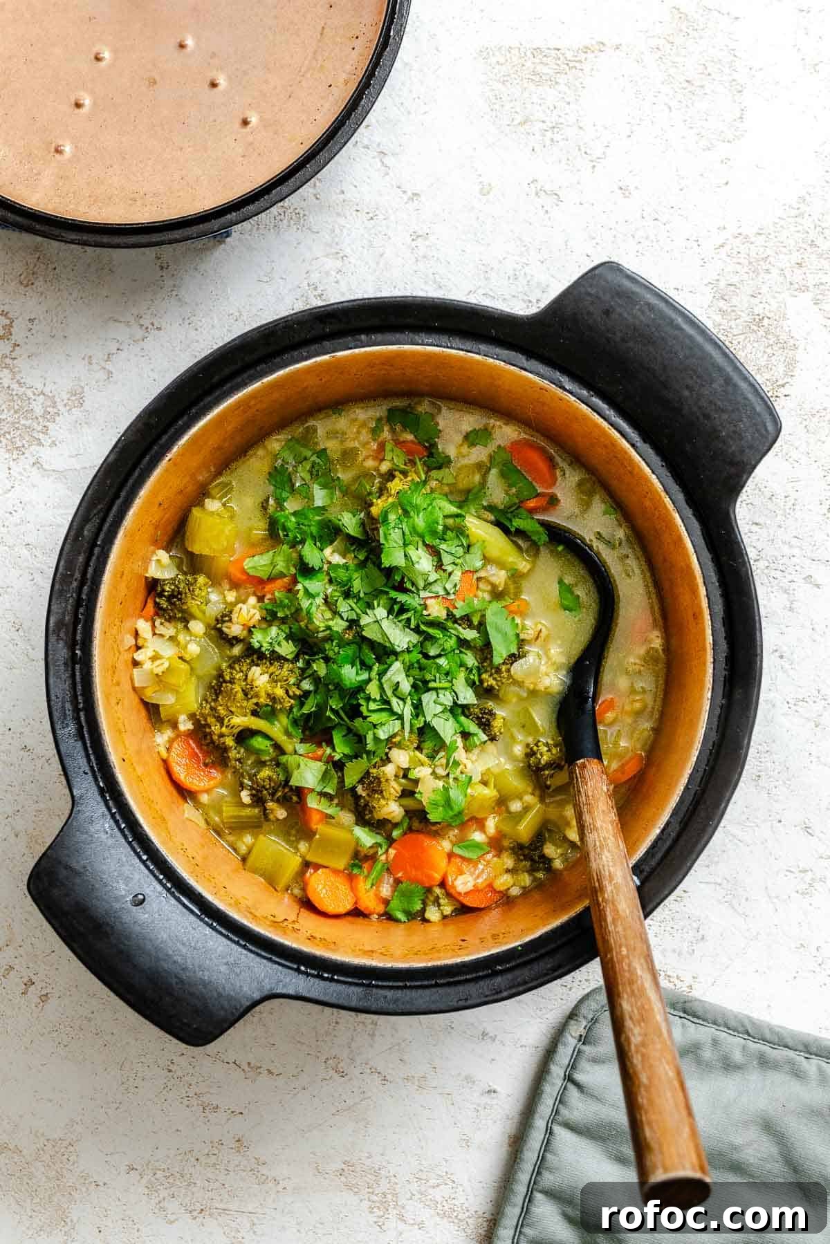 Hearty Vegetable and Barley Soup Recipe for Cozy Meals 6 Process shot showing veggies cooking in pot.