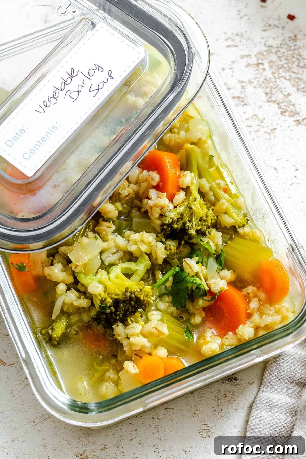 Hearty Vegetable and Barley Soup Recipe for Cozy Meals 8 Completed Vegetable Barley Soup in a storage container.
