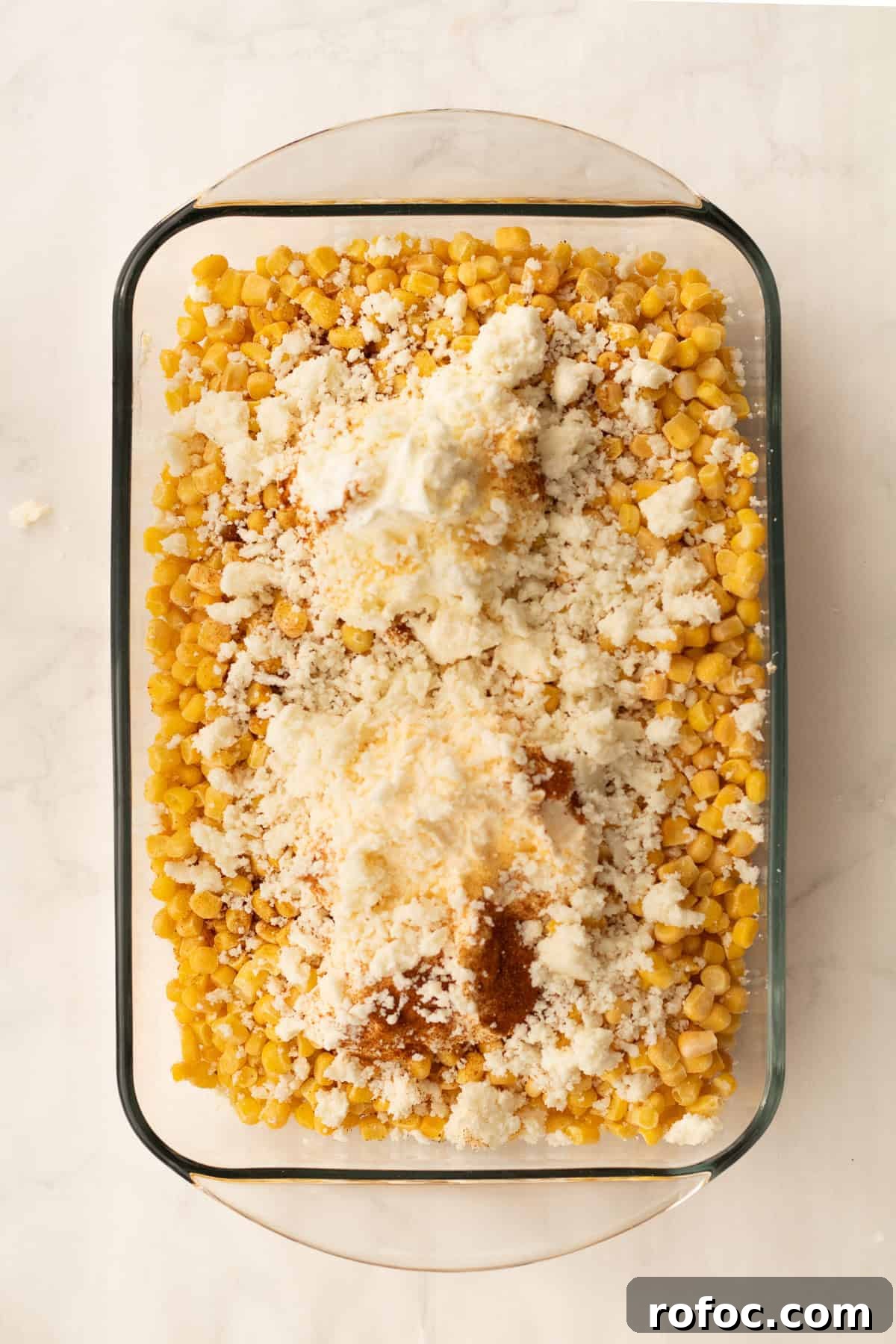 6-Ingredient Mexican Street Corn Casserole Recipe 4 all ingredients for street corn casserole in glass baking dish