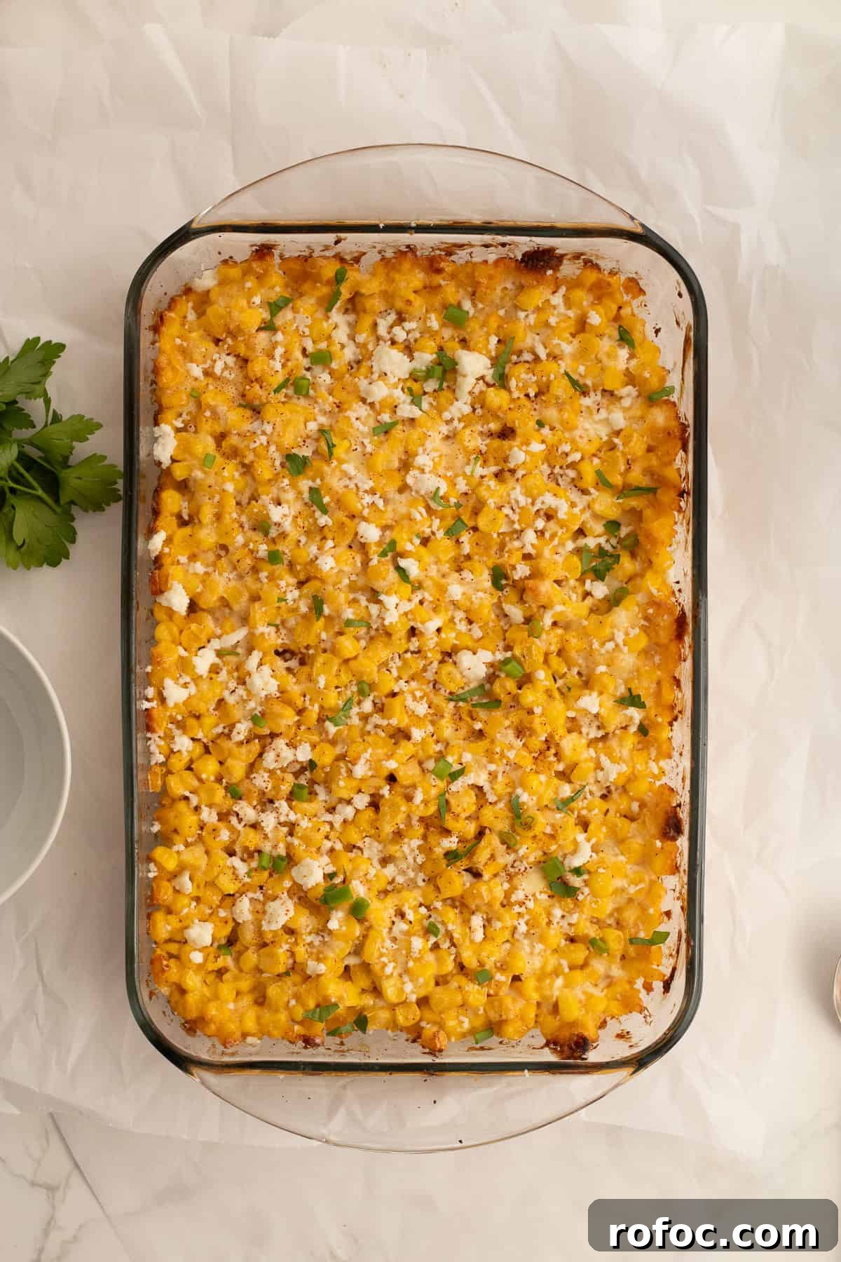 6-Ingredient Mexican Street Corn Casserole Recipe 6 mexican street corn baked in a dish with extra queso fresco and green onion