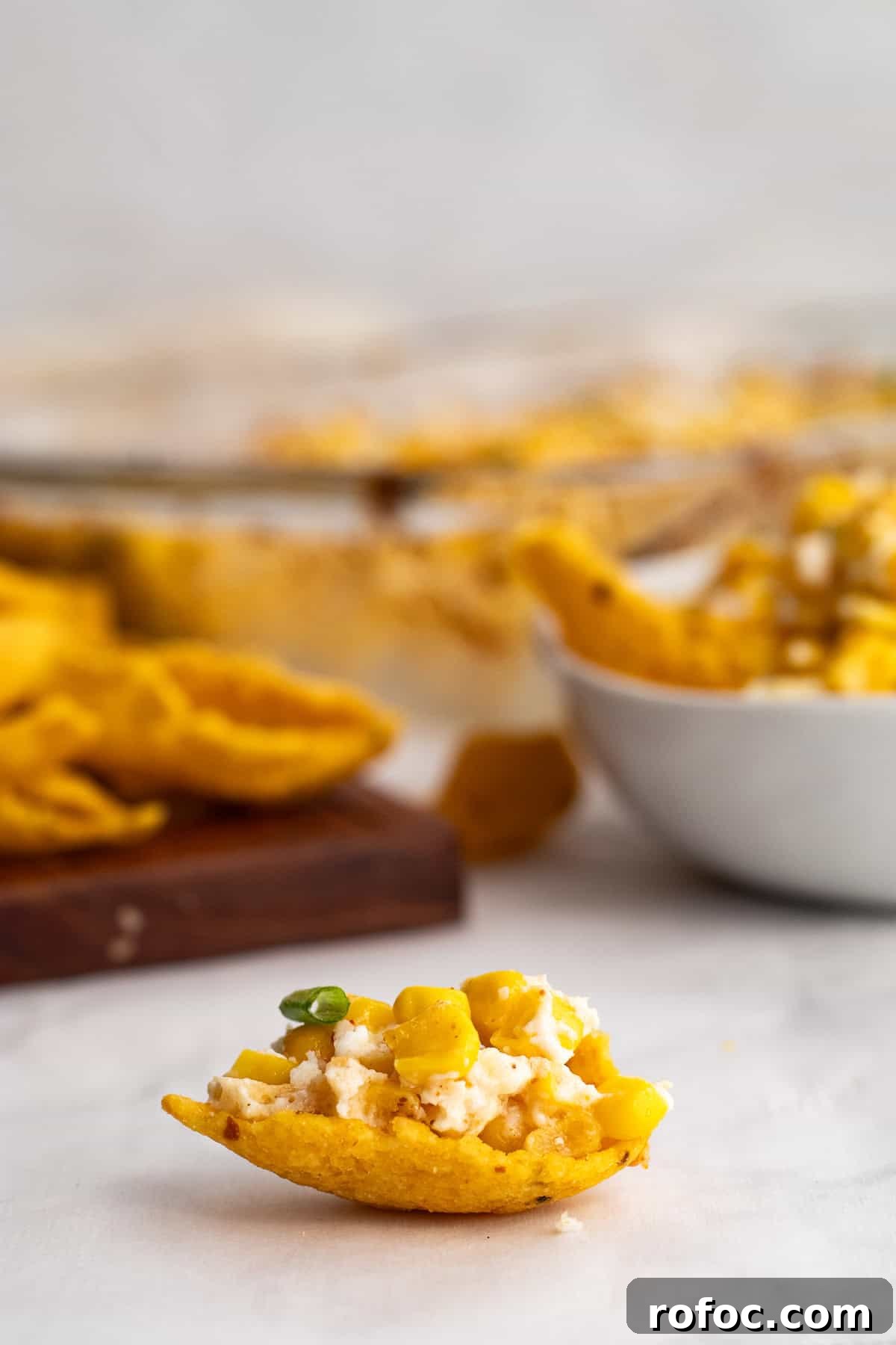 6-Ingredient Mexican Street Corn Casserole Recipe 8 one corn chip with mexican corn dip on it