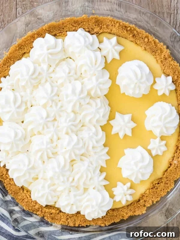Graham Cracker Crust Recipe: Simple Steps for Perfect Pie Crust 15 Overhead shot of a finished lemon pie decorated with homemade whipped cream.