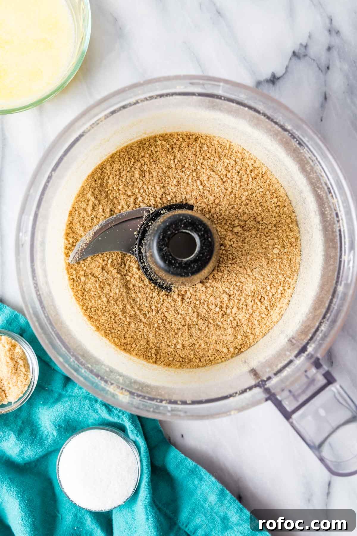 Graham Cracker Crust Recipe: Simple Steps for Perfect Pie Crust 4 Overhead view of graham cracker crumbs in a food processor.