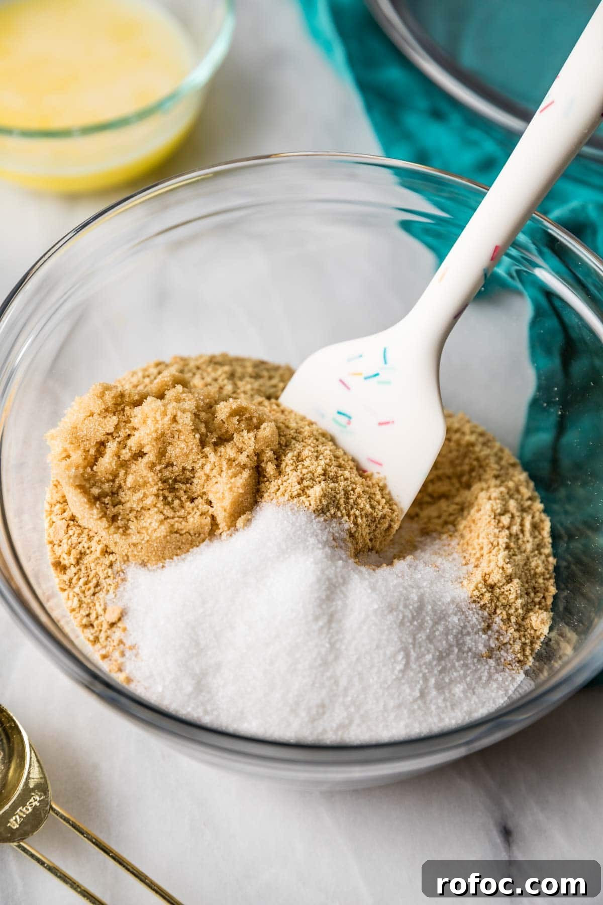 Graham Cracker Crust Recipe: Simple Steps for Perfect Pie Crust 5 Graham cracker crumbs and sugar being stirred together with a spatula.