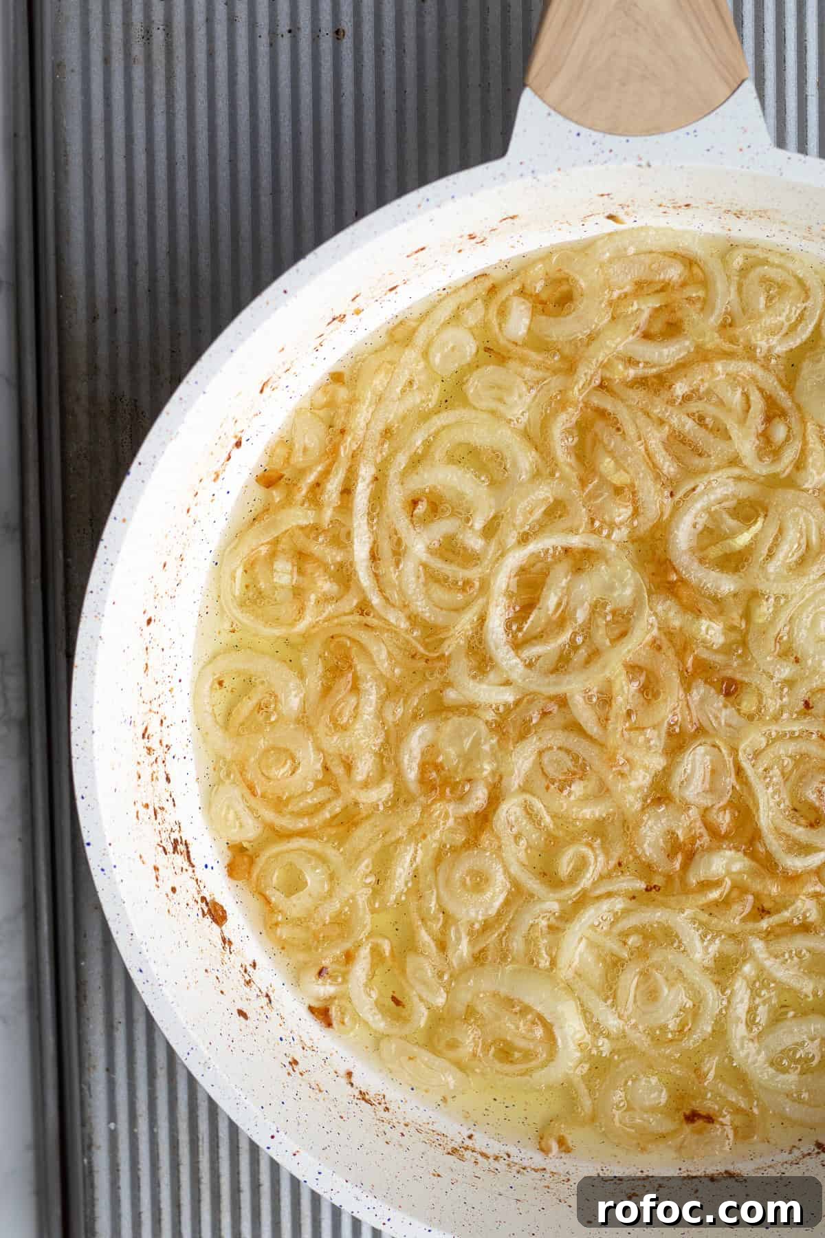 onions frying in a pan