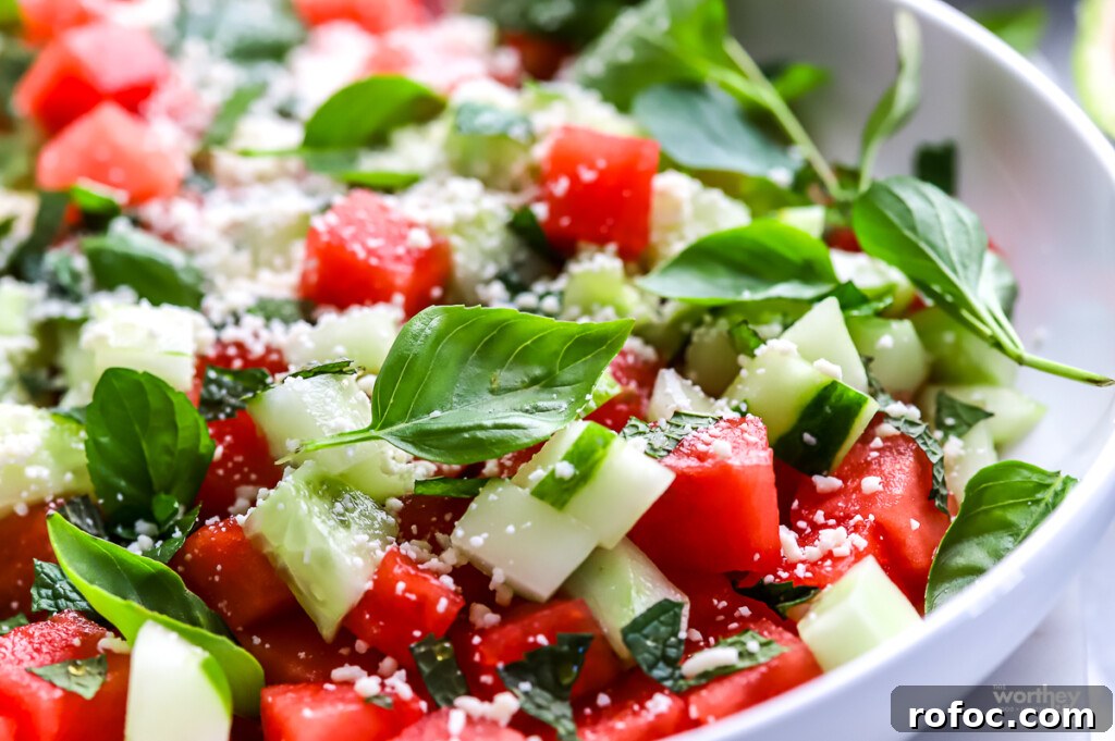 Refreshing Watermelon, Cucumber and Basil Salad 9 A serving bowl filled with watermelon cucumber basil salad.