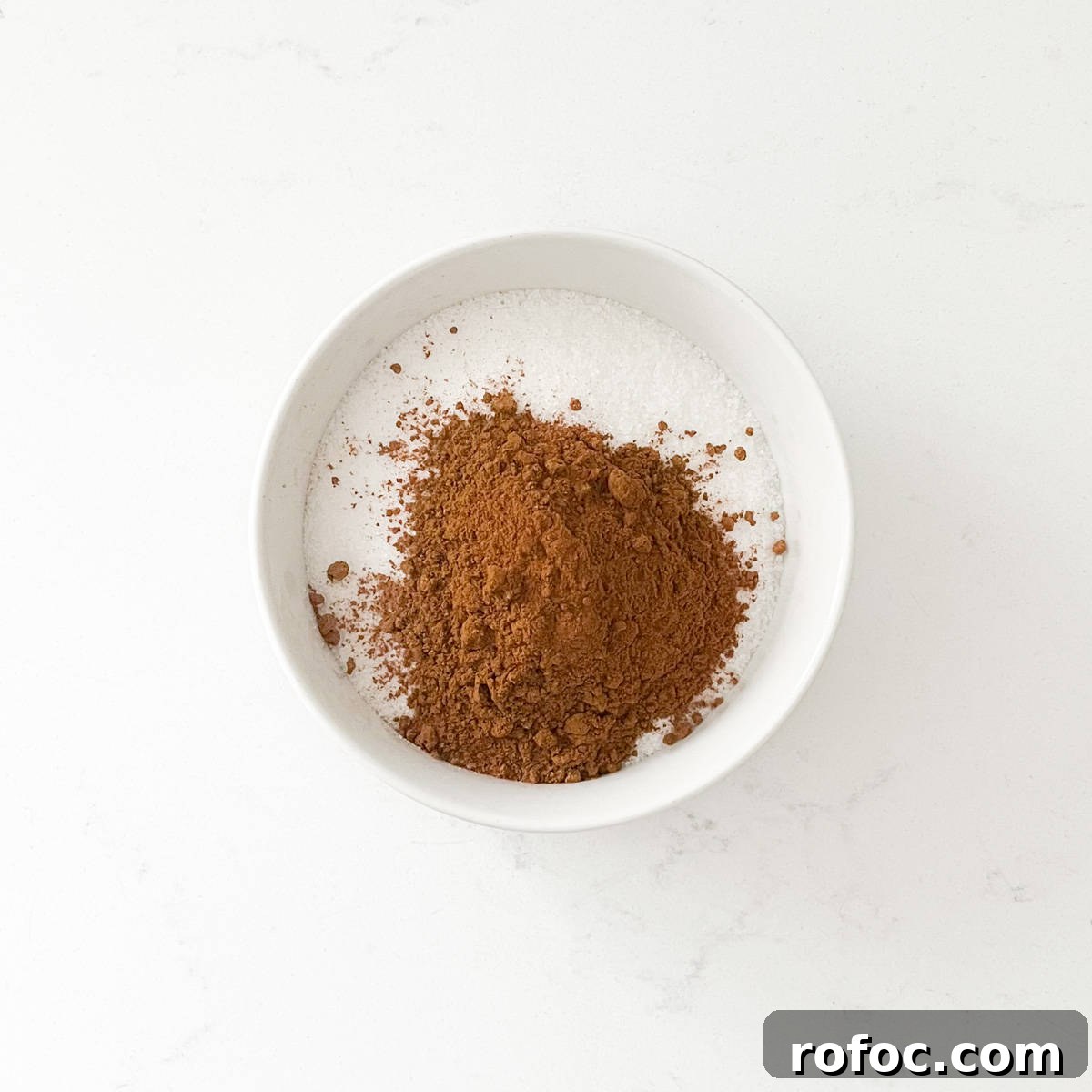 Sugar and cinnamon in a small bowl.