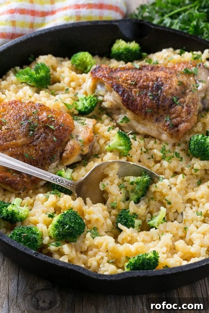 A serving spoon in chicken and rice casserole.