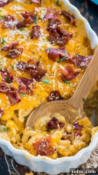 Cheesy Crack Chicken Casserole is the perfect dish to feed a large crowd. Deliciously cheesy and loaded with tender chicken and topped with crispy bacon.