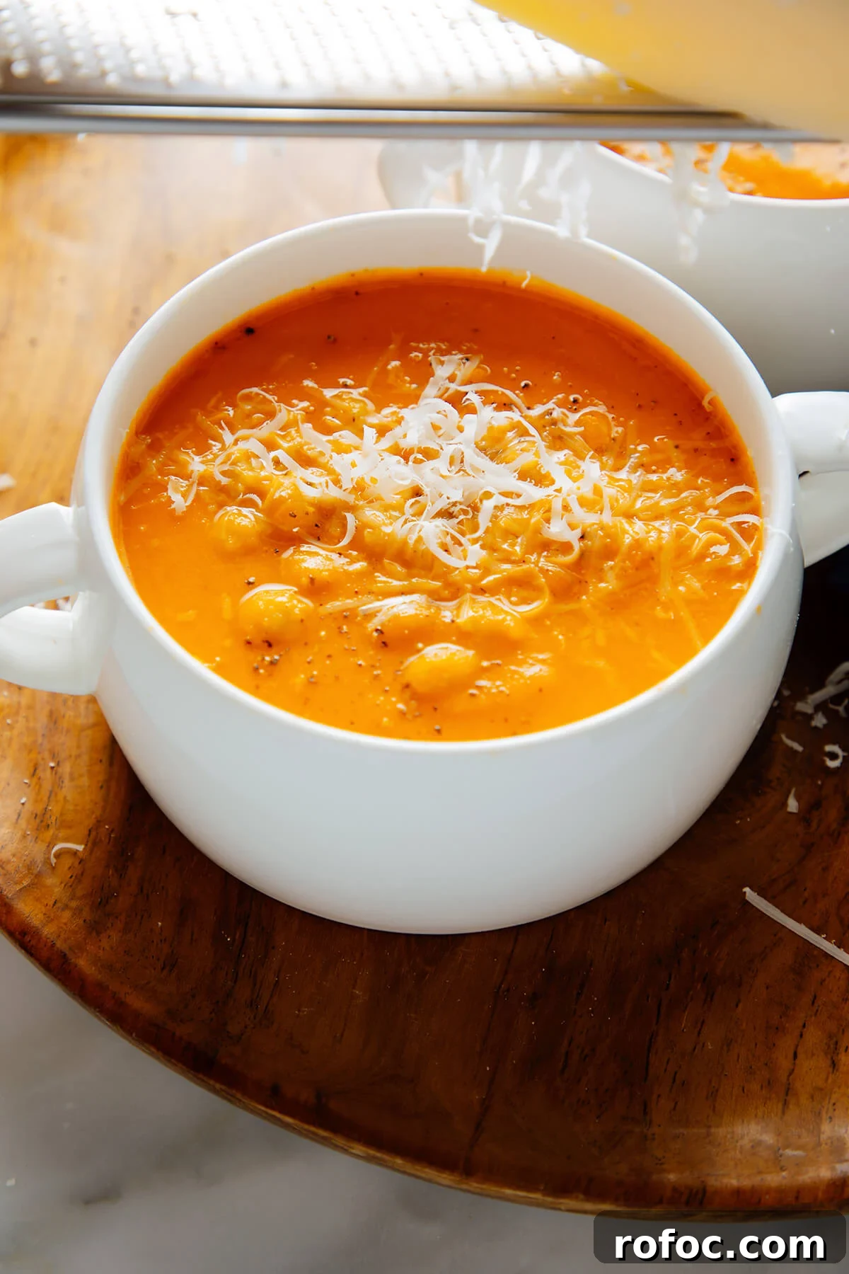 grating parmesan into soup