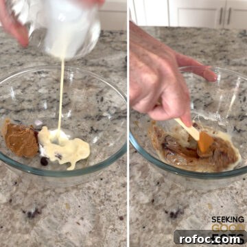 Mixing together wet ingredients for making no bake gingerbread protein balls in a clear glass bowl.