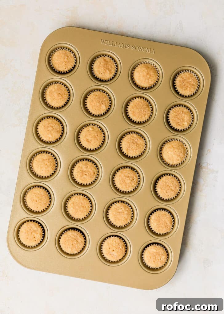 Mini Vanilla Cupcakes: Tender Bite-Sized Recipe 9 A pan of mini vanilla cupcakes.