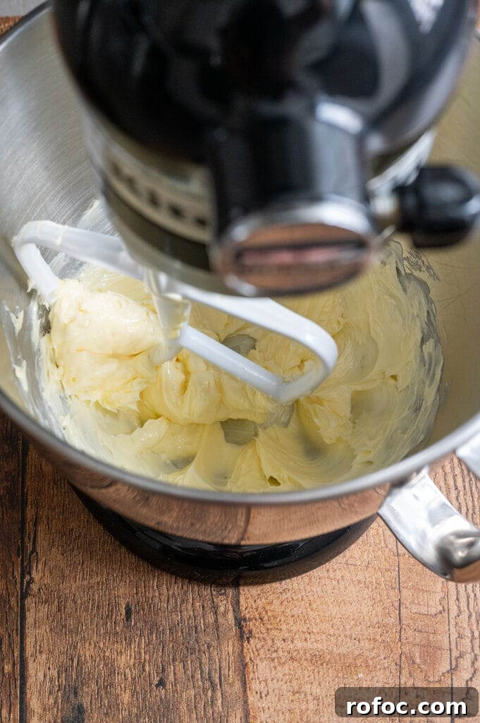 Beating the butter.
