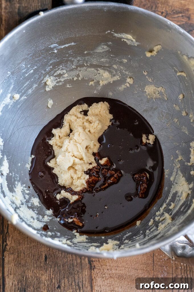 Mixing the white dough into the chocolate.